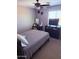Functional bedroom with ceiling fan and window, offering a comfortable and practical living space at 10335 W Pima St, Tolleson, AZ 85353