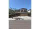 Two-story home with neutral paint, two-car garage, and low-maintenance landscaping at 10335 W Pima St, Tolleson, AZ 85353