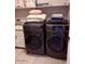 Modern laundry room with front load washer and dryer, providing efficient and convenient laundry solutions at 10335 W Pima St, Tolleson, AZ 85353