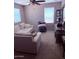 Bright living room with comfortable seating and carpet, creating a welcoming and relaxing space at 10335 W Pima St, Tolleson, AZ 85353