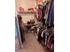 Spacious walk-in closet with shelving and hanging racks, offering ample storage for clothes and accessories at 10335 W Pima St, Tolleson, AZ 85353
