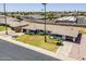 Beautiful home showcasing a well-kept lawn, mature trees, and desert landscaping at 11135 W Cameo Dr, Sun City, AZ 85351