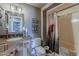 Well decorated bathroom with framed mirror, granite vanity, and framed typography art at 11135 W Cameo Dr, Sun City, AZ 85351