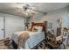 Bedroom featuring a large bed with natural-colored bedding, and neutral-colored walls at 11135 W Cameo Dr, Sun City, AZ 85351