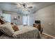 Bedroom with natural light, ceiling fan, and well decorated furnishings at 11135 W Cameo Dr, Sun City, AZ 85351