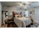 Bedroom with natural light, ceiling fan, and well decorated furnishings at 11135 W Cameo Dr, Sun City, AZ 85351