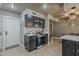 The kitchen boasts stainless steel appliances, modern countertops, and ample storage space at 11135 W Cameo Dr, Sun City, AZ 85351