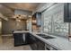 This modern kitchen boasts sleek countertops, stainless steel appliances, and ample natural light at 11135 W Cameo Dr, Sun City, AZ 85351