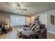 Inviting living room with tile floors, comfortable seating, and plenty of natural light at 11135 W Cameo Dr, Sun City, AZ 85351