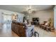 Comfortable living room featuring tile floors, ceiling fan, neutral paint, and an open floor plan at 11135 W Cameo Dr, Sun City, AZ 85351