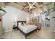 Comfortable bedroom with modern decor, concrete ceilings, and a cozy seating area at 114 W Adams St # 202, Phoenix, AZ 85003