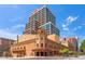 Impressive building exterior showcasing historic architecture and modern design elements against a blue sky at 114 W Adams St # 202, Phoenix, AZ 85003