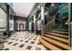 Elegant building lobby boasting marble floors, decorative staircase, and sophisticated design elements at 114 W Adams St # 202, Phoenix, AZ 85003