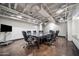 Conference room with a large black table, and seating for ten at 114 W Adams St # 202, Phoenix, AZ 85003