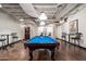 Inviting game room with a full-size pool table, comfortable seating, and ample space for entertainment at 114 W Adams St # 202, Phoenix, AZ 85003