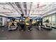 Modern gym with treadmills, exercise bikes, weight machines, and a vibrant mural at 114 W Adams St # 202, Phoenix, AZ 85003