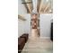 Hallway view of a modern apartment with exposed brick and a comfortable bedroom at 114 W Adams St # 202, Phoenix, AZ 85003