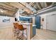 Open concept kitchen with quartz countertops, stainless steel appliances, and adjacent seating area at 114 W Adams St # 202, Phoenix, AZ 85003