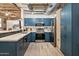 Updated kitchen featuring blue cabinets, stainless steel appliances, and marble backsplash at 114 W Adams St # 202, Phoenix, AZ 85003