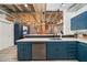 Kitchen with island features stainless steel appliances, custom cabinets, and updated lighting at 114 W Adams St # 202, Phoenix, AZ 85003