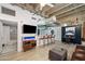 Open concept living room featuring modern décor, a breakfast bar, and an adjacent bathroom at 114 W Adams St # 202, Phoenix, AZ 85003