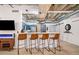 Open living space boasts modern finishes, breakfast bar, and exposed ceiling with industrial accents at 114 W Adams St # 202, Phoenix, AZ 85003