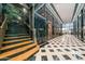 Grand lobby with marble accents, tiled floors and staircase leading to elevator access at 114 W Adams St # 202, Phoenix, AZ 85003