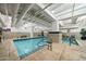 Indoor pool and jacuzzi with tiled deck and steps, offering a refreshing amenity at 114 W Adams St # 202, Phoenix, AZ 85003
