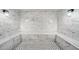 Inviting steam room with tiled walls, seating, and lighting at 114 W Adams St # 202, Phoenix, AZ 85003