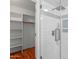 Bathroom featuring a glass shower and a walk-in closet at 1201 E Campbell Ave, Gilbert, AZ 85234