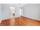 Empty bedroom featuring wood floors and an ensuite bathroom at 1201 E Campbell Ave, Gilbert, AZ 85234