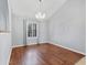 Dining room featuring wood floors, neutral paint and a chandelier at 1201 E Campbell Ave, Gilbert, AZ 85234