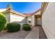 Charming courtyard leading to the front door, surrounded by manicured bushes and a quaint seating area at 1201 E Campbell Ave, Gilbert, AZ 85234