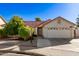 Lovely single-story home with a well-maintained front yard, a spacious driveway, and a two-car garage at 1201 E Campbell Ave, Gilbert, AZ 85234