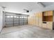 Spacious garage with storage cabinets and work space has room for multiple cars at 1201 E Campbell Ave, Gilbert, AZ 85234
