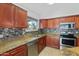 Well-appointed kitchen featuring stainless steel appliances, granite countertops and tile backsplash at 1201 E Campbell Ave, Gilbert, AZ 85234