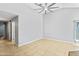 Spacious living room featuring tile floors, a ceiling fan, and neutral paint colors at 1201 E Campbell Ave, Gilbert, AZ 85234