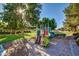 Community playground under mature trees with slide and climbing areas; common area amenity at 1201 E Campbell Ave, Gilbert, AZ 85234