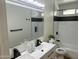 Modern bathroom features a double sink vanity and tiled shower-tub combo at 1309 E Julie Dr, Tempe, AZ 85283