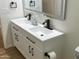 Elegant bathroom featuring a double sink vanity, matte black hardware, and modern mirror at 1309 E Julie Dr, Tempe, AZ 85283