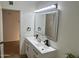 Modern bathroom features a double sink vanity with a lighted mirror at 1309 E Julie Dr, Tempe, AZ 85283