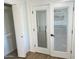 Bright bedroom features a closet and stylish glass doors with blinds at 1309 E Julie Dr, Tempe, AZ 85283