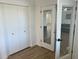 Bright bedroom area showcasing a closet, glass paneled doors, and neutral colors at 1309 E Julie Dr, Tempe, AZ 85283