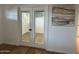 Bright bedroom showcases wood-look floors and glass paneled french doors at 1309 E Julie Dr, Tempe, AZ 85283
