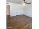 Spacious bedroom showcasing wood-look floors, closet, and neutral walls at 1309 E Julie Dr, Tempe, AZ 85283