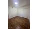 Bedroom featuring wood-look flooring and ample closet space at 1309 E Julie Dr, Tempe, AZ 85283