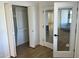 Bright bedroom features a closet and stylish glass doors at 1309 E Julie Dr, Tempe, AZ 85283