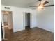 Bedroom view with open closet, ceiling fan, and light neutral walls at 1309 E Julie Dr, Tempe, AZ 85283