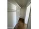 Walk-in closet with built-in shelves and wood-look floors at 1309 E Julie Dr, Tempe, AZ 85283