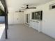 Covered patio includes white trim, built in bar, ceiling fans, and door leading to the backyard at 1309 E Julie Dr, Tempe, AZ 85283